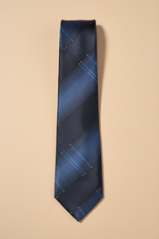 Gravata azul marinho xadrez — fundo bege